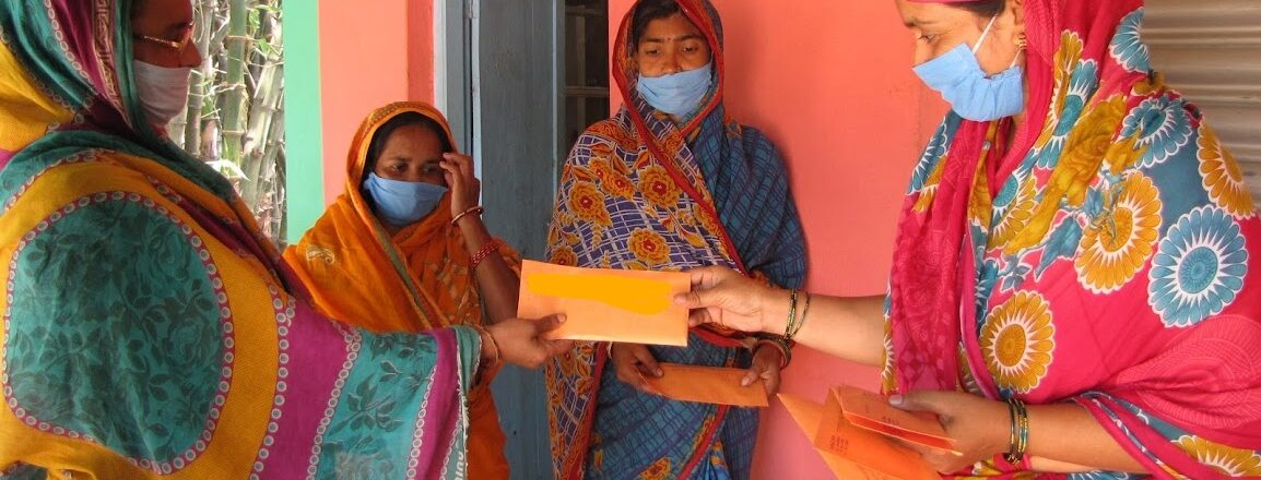 4 Indian women with envelopes