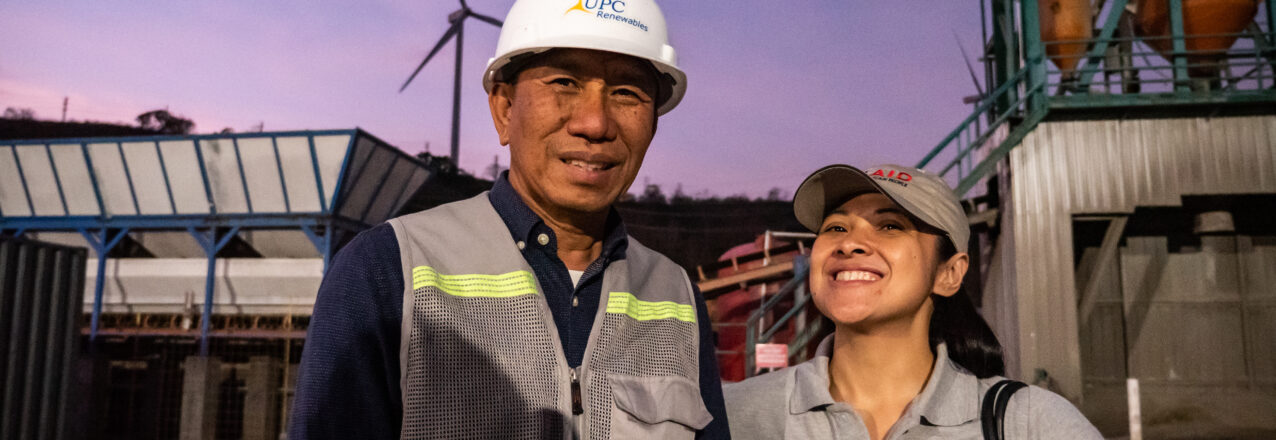 Man and woman in front of a windmill.