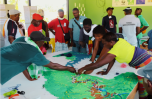 Community members reviewing a participatory map of their territory during a land-use and conservation planning discussion.