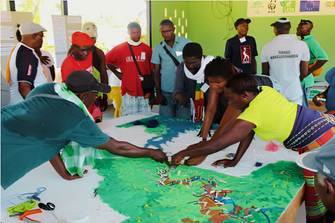 Community members reviewing a participatory map of their territory during a land-use and conservation planning discussion.