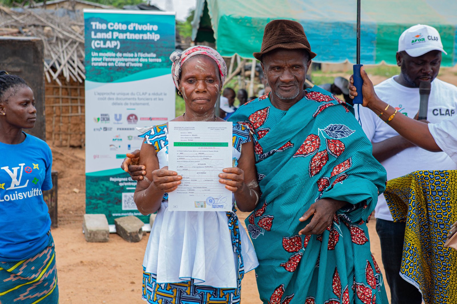 Woman in the Cavally region holds her land use agreement
